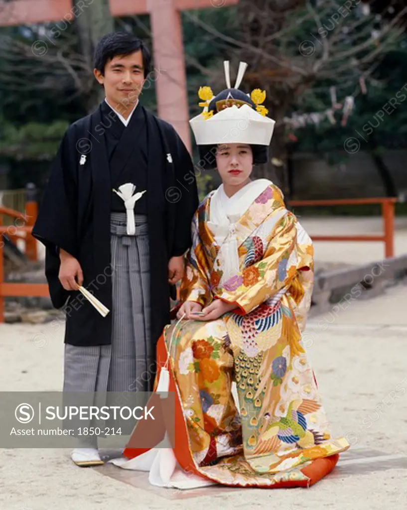 Japan, Honshu, Kyoto, Traditional Wedding.  Portrait Of Bride And Groom.