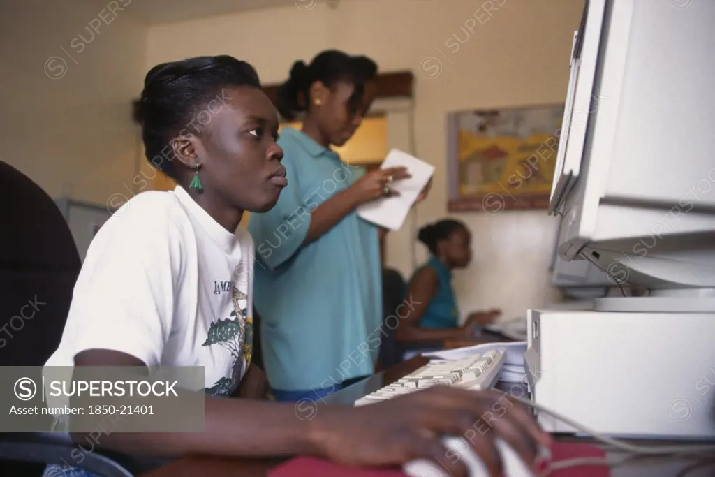 Uganda, Kampala, Woman Working On Computer In Wfp Ntiuda Stores Supplying Convoys To Rwanda And Sudan.