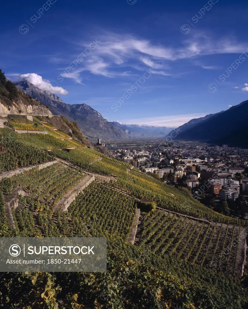 Switzerland, Valais, Martigny, Elevated View East Along Rhone Valley Above Vinyards And Town