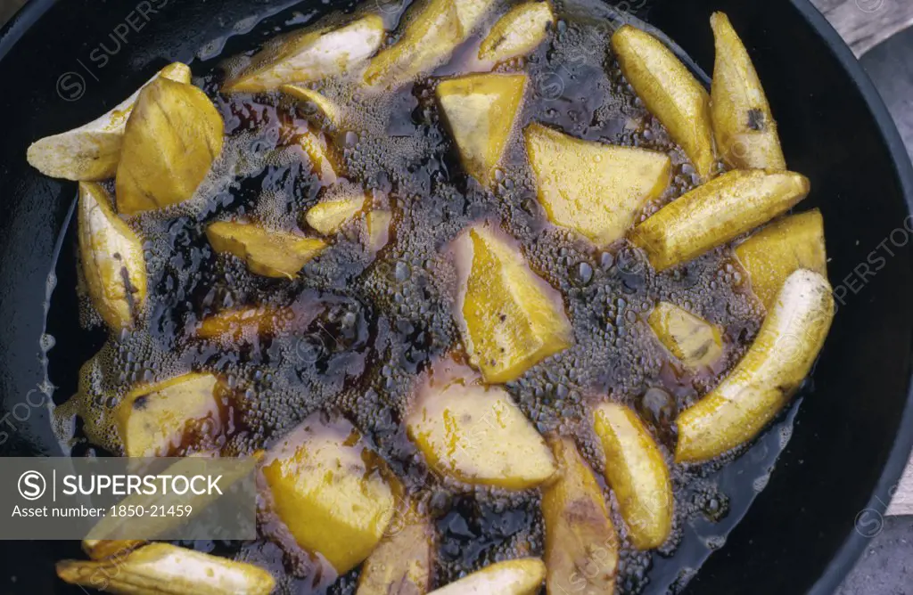 Nigeria, Food, Cassava And Plantain Frying In Oil.