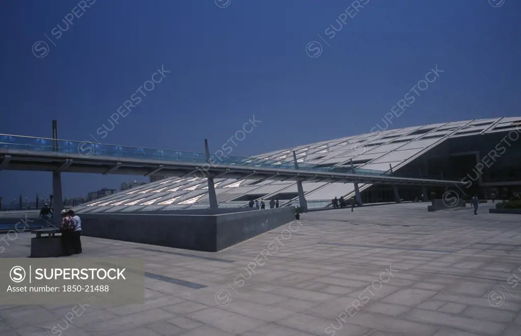 Egypt, Nile Delta, Alexandria, Bibliotheca Alexandrina Modern Library Exterior With View From Complex Towards Long Slender Bridge Leading To Entrance
