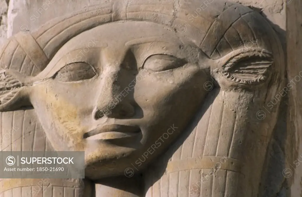 Egypt, Nile Valley, Thebes, Deir-El-Bari. Hepshepsut Mortuary Temple. Carved Column With Head Of Goddess Hathor Represented With Cows Ears. One Of The Hathoric Columns.