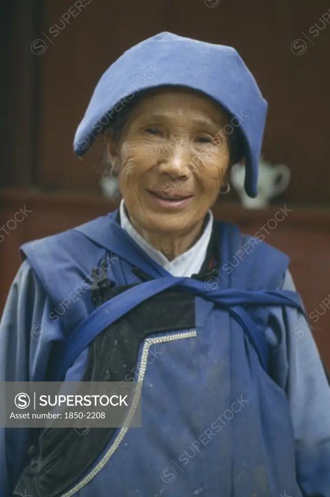 China, Yunnan, Baisha, Naxi Lady In Traditional Blue Clothes