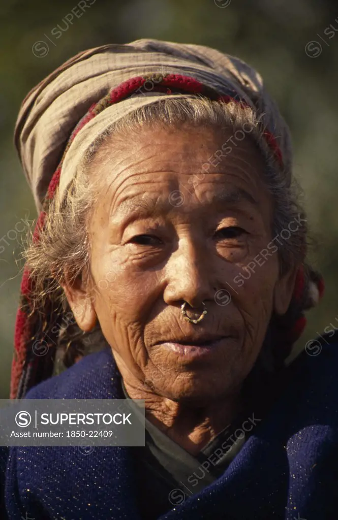 Nepal, East, Palati, Head And Shoulders Portrait Of Elderly Woman Wearing A Nose Ring In Palati Village Near The Arun River Valley