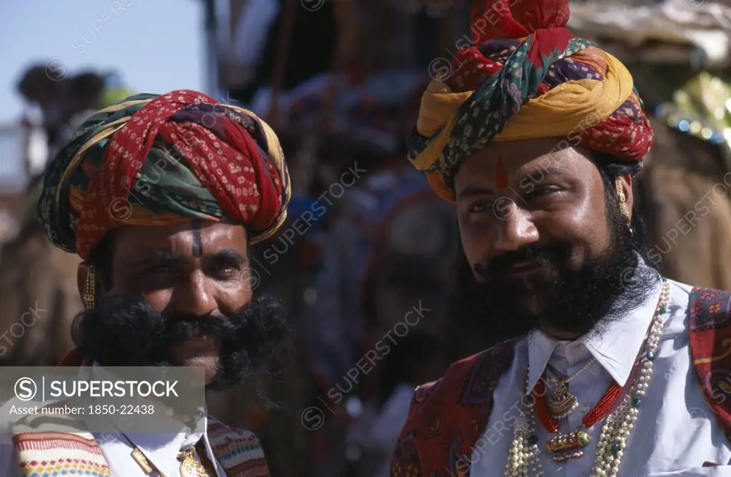 India, Rajasthan, Bikaner, Two Rajput Men With Beards Wearing Ceremonial Dress And Turbans At The Start Of The Camel Festival