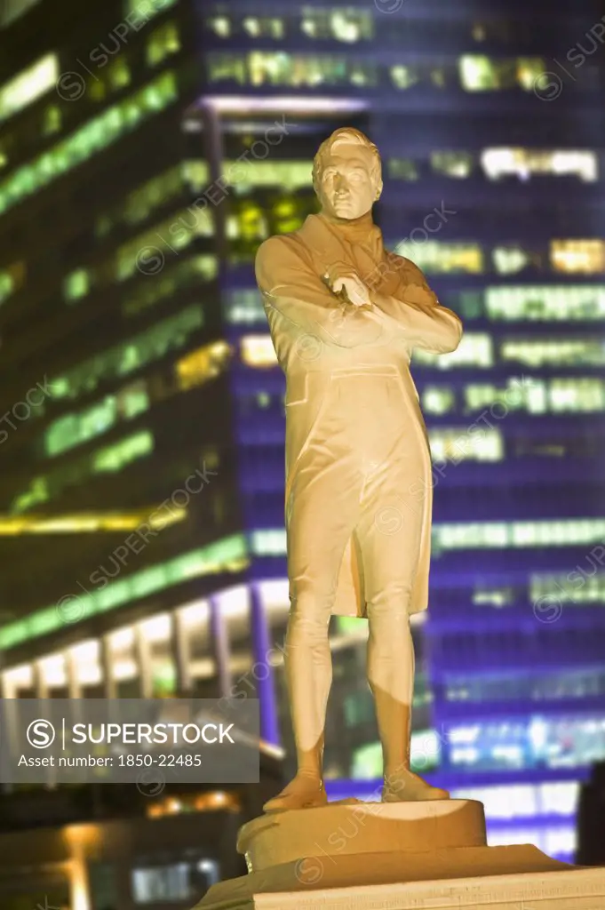 Singapore, Raffles, Statue Of Sir Stamford Raffles Illuminated At Night.