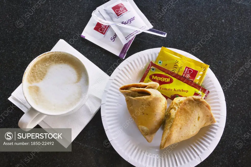 India, Food, Cappuccino And Samosas In A Modern Coffee Shop.