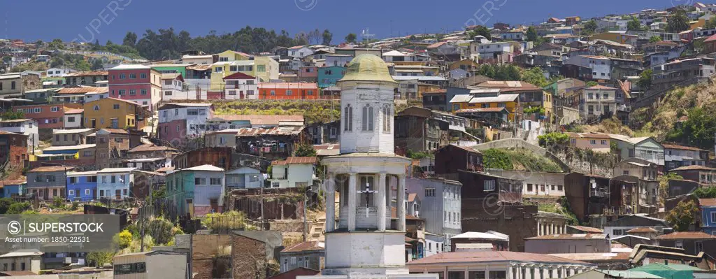 Chile, Valparaiso, The Steeple Of Iglesia Matriz With Typical Valparaiso Housing Rising Behind.