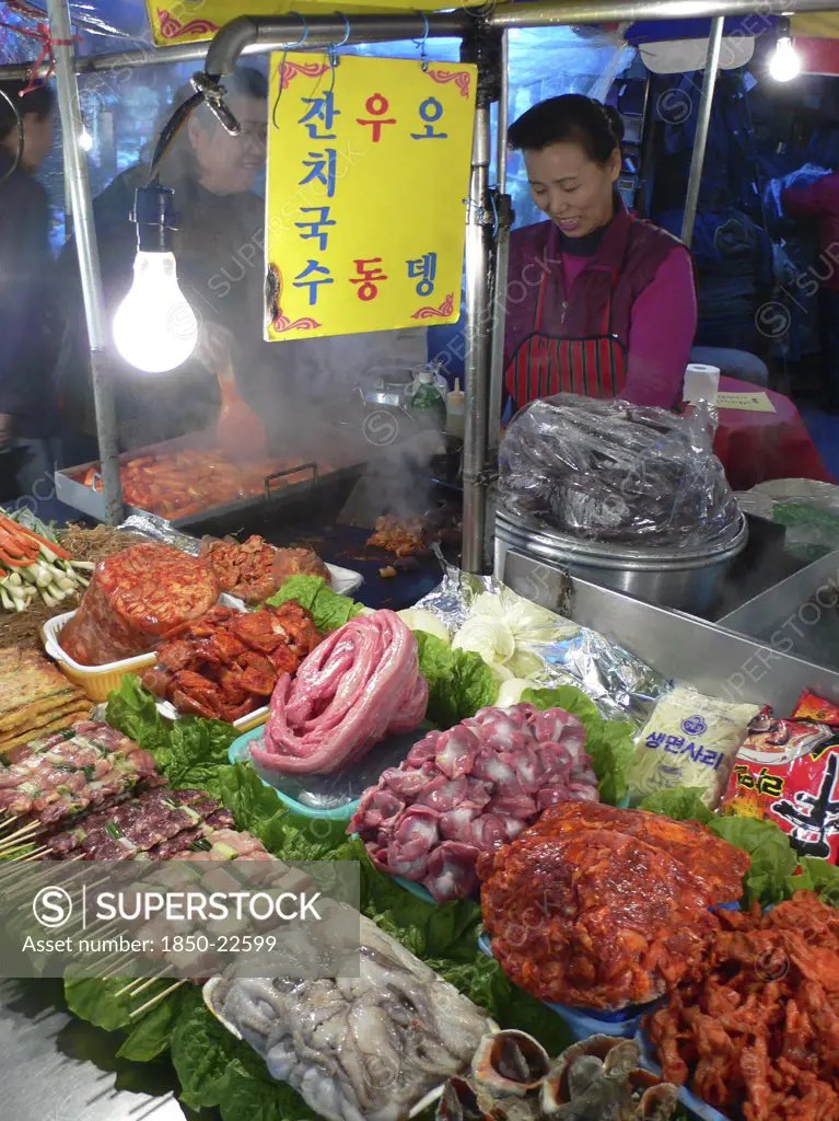Korea, South, Seoul, 'Namdaemun - Namdaemun Market, December Evening, Food Stall With Chicken, Meat, And Fish Waiting To Be Cooked'