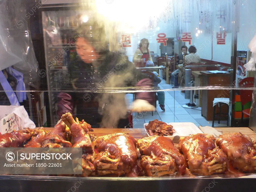 Korea, South, Seoul, 'Namdaemun - Namdaemun Market, Outside A Roast Pork Restaurant, Woman Cutting Pork'