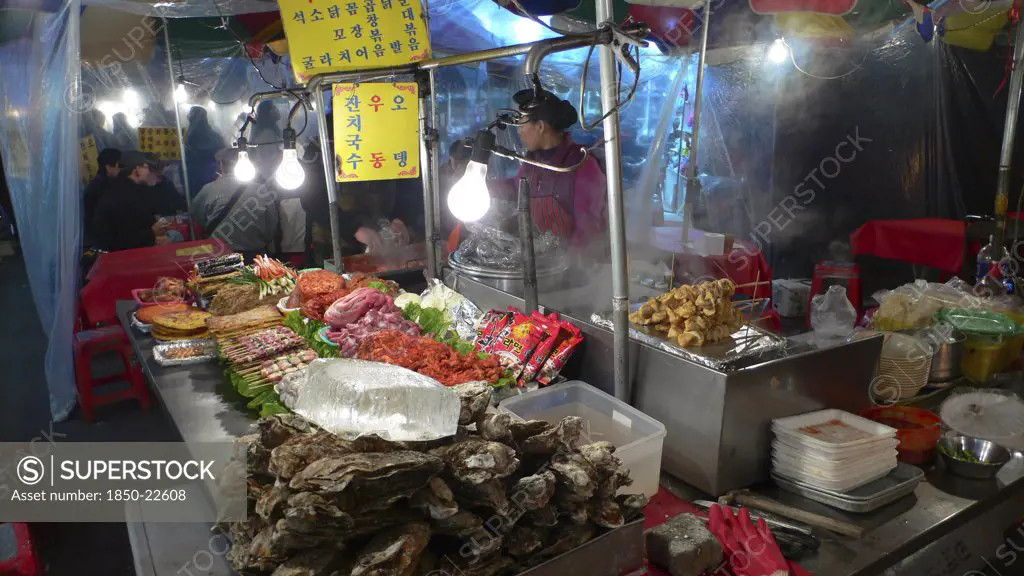 Korea, South, Seoul, 'Namdaemun Market, Street Restaurant, Stacks Of Meat And Fish Waiting To Be Dooked, Oysters In Foreground'