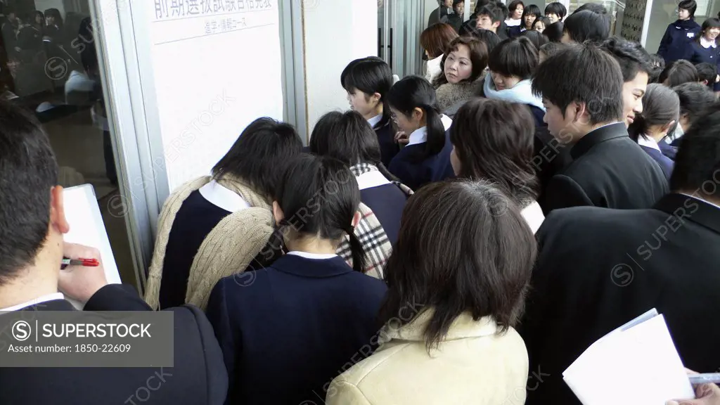 Japan, Honshu, Tokyo, 'Chiba, Sosa - Yokaichiba Kei Ai High School, 14 And 15 Year Old Third Year Junior High School Students Crowd To See If Their Number Is Posted Meaning They Passed The High School Entrance Exam'