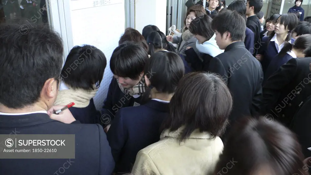 Japan, Honshu, Tokyo, 'Chiba, Sosa - Yokaichiba Kei Ai High School, 14 And 15 Year Old Third Year Junior High School Students Check To See If Their Number Is Posted Meaning They Passed Trhe High School Entrance Exam'