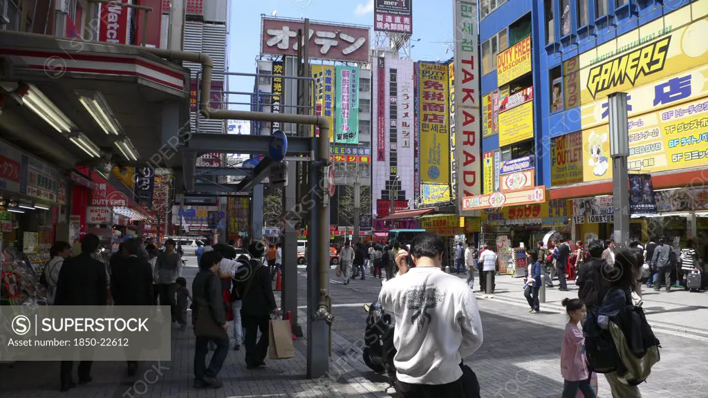 Japan, Honshu, Tokyo, 'Akihabara ''Electric City'', Near The Train Station, Crowds, Jumble Of Signs'