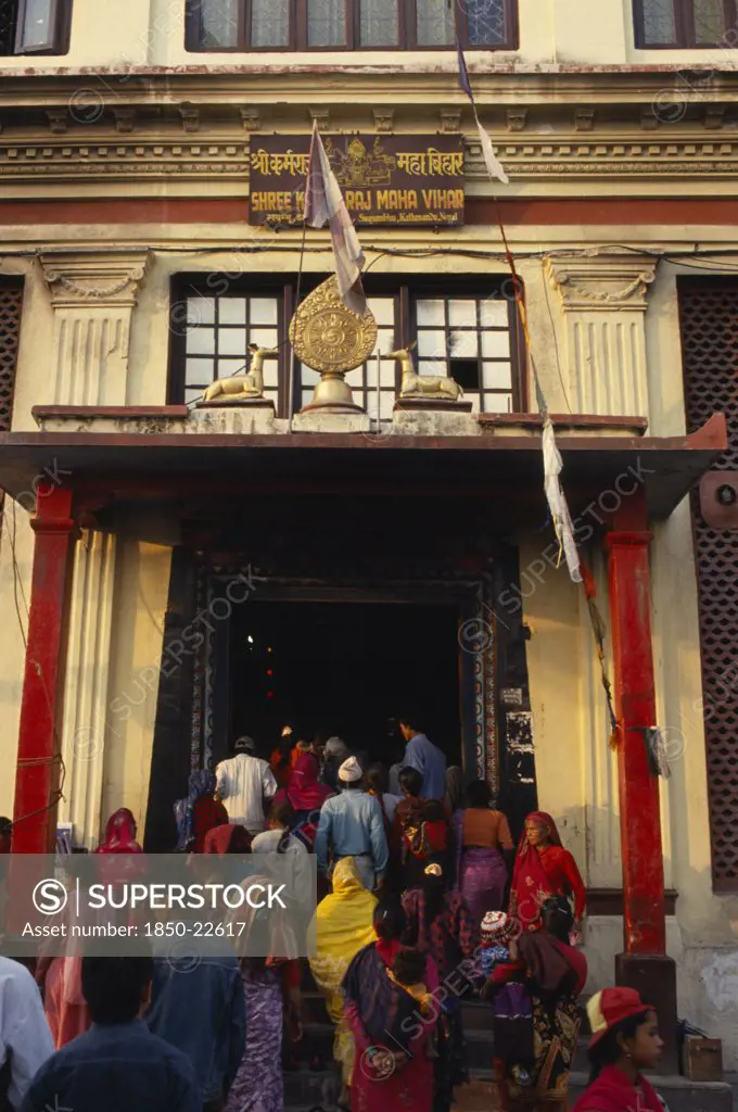 Nepal, Kathmandhu Valley, Swayambhunath, Buddhist Pilgrims At Temple Stupa Entrance.