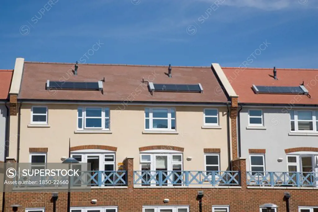 England, West Sussex, Shoreham-By-Sea, Ropetackle Housing Development On The Banks Of The River Adur. A Regenerated Brownfield Former Industrial Area. Solar Heating Panels Visible In The Rooftops.