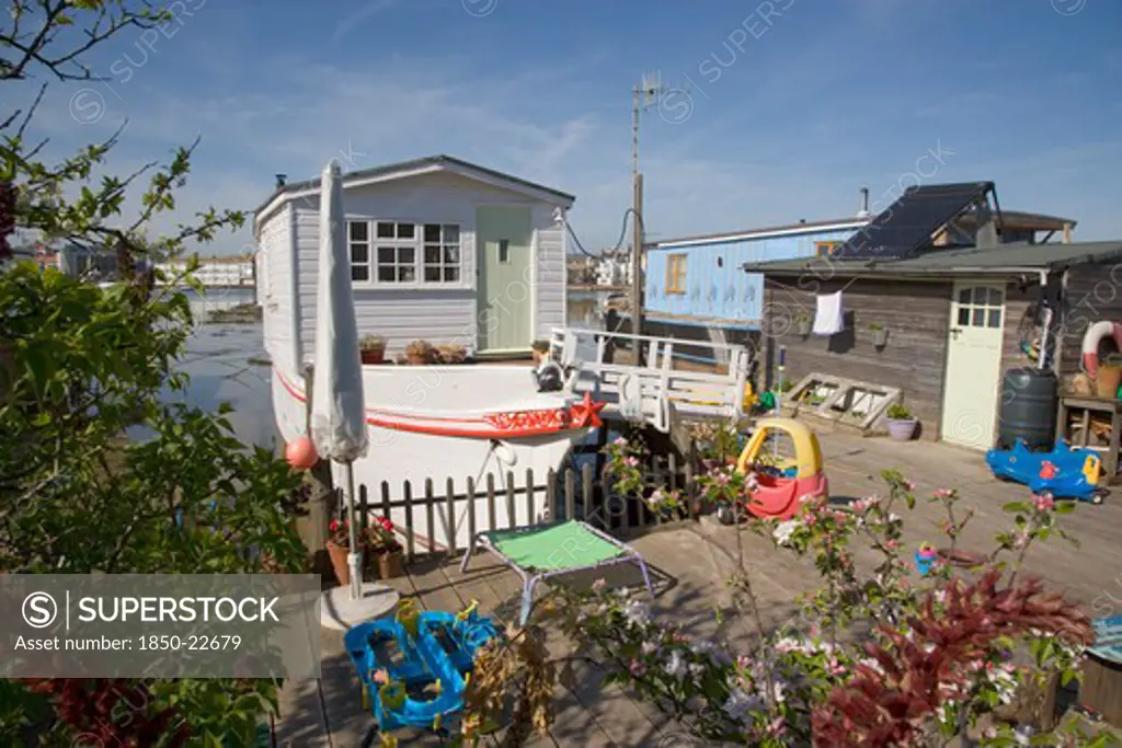 England, West Sussex, Shoreham-By-Sea, Houseboat Moored Along The Banks Of The River Adur.  Former Barges And Old Boats Converted Into Homes .