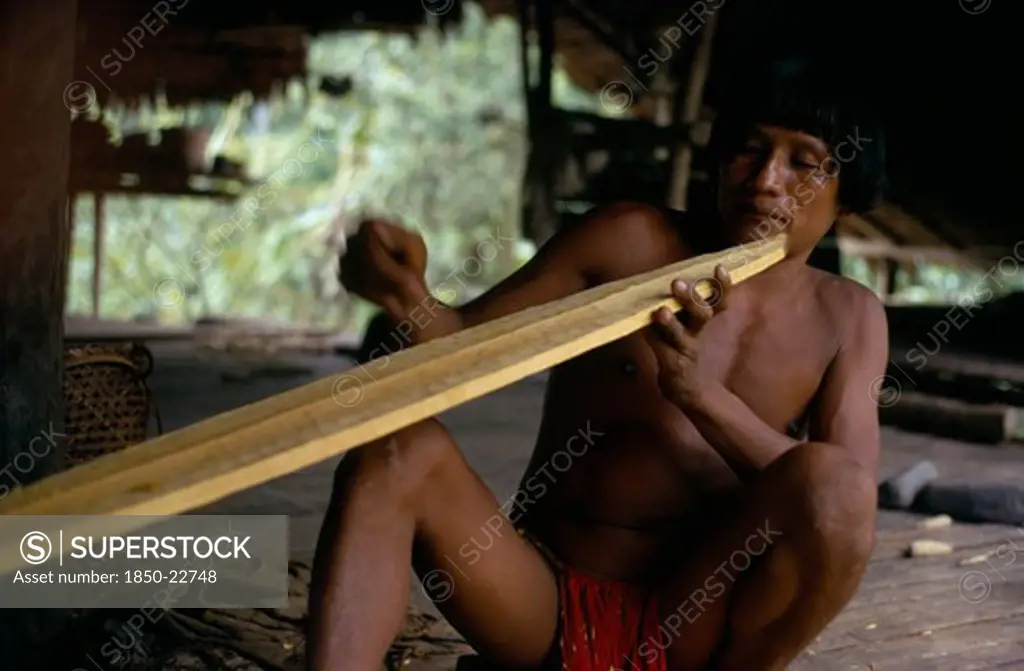 Colombia, Choco, Embera Indigenous People, Embera Family Head  Heraklio  Finely Shaping Wooden Canoe Paddle At Riverside Home On Rio Baudo  Pacific Coastal Region Boat Oar Tribe American Colombian Colombia Hispanic Indegent Latin America Latino Male Men Guy South America  Pacific Coastal Region Boat Oar Tribe American Colombian Columbia Hispanic Indegent Latin America Latino Male Men Guy South America Male Man Guy One Individual Solo Lone Solitary 1 Single Unitary
