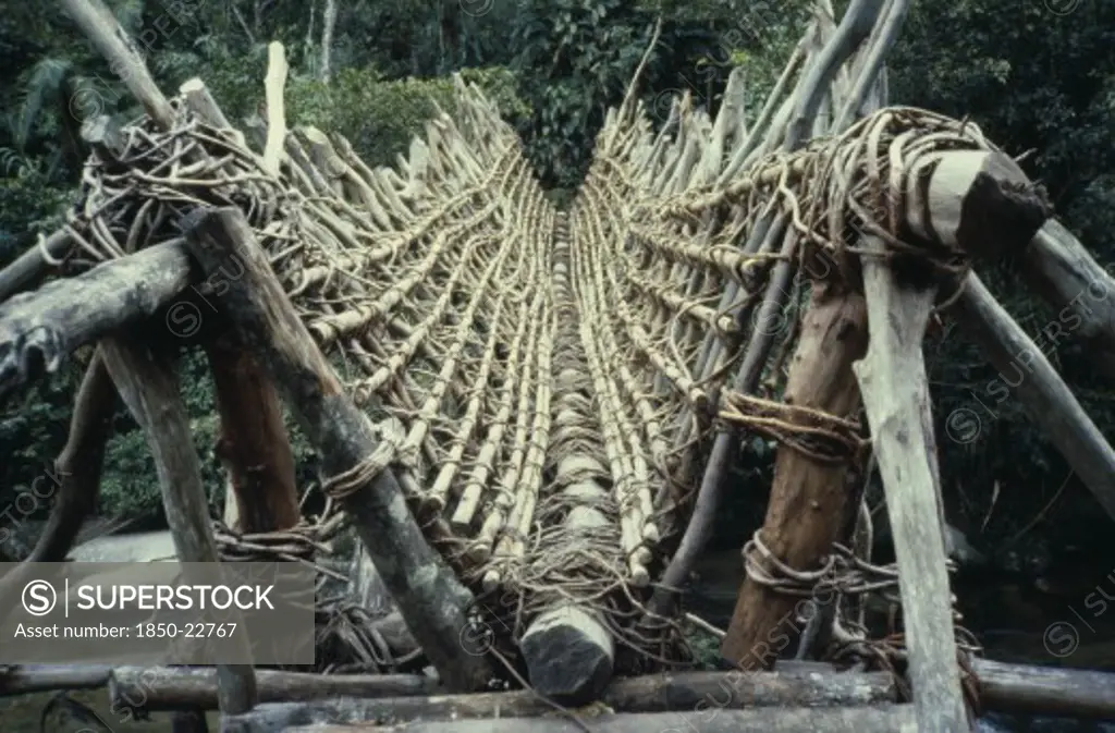 Colombia, Sierra Nevada De Santa Marta, Ika, Ika Bridge Made From Timbers Lashed Together With Vines  V-Shaped To Allow Loaded Mules And Oxen To Cross. Arhuaco Aruaco Indigenous Tribe American Colombian Colombia Hispanic C39Indegent Latin America Latino South America  Arhuaco Aruaco Indigenous Tribe American Colombian Columbia Hispanic Indegent Latin America Latino South America