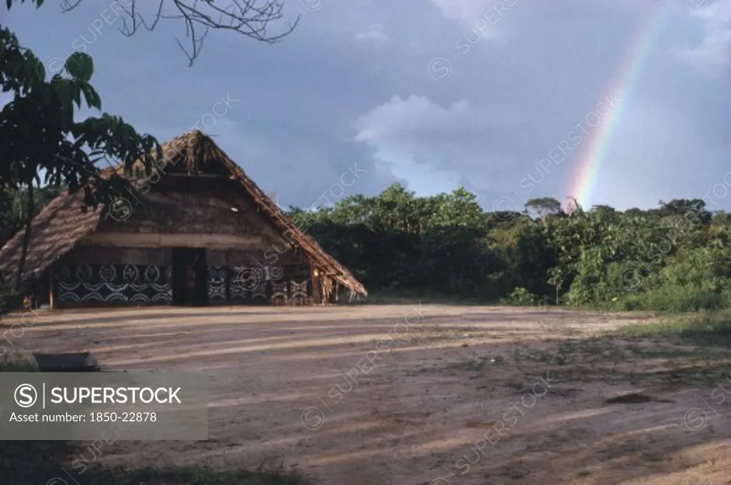 Colombia, North West Amazon, Tukano Indigenous People, Makuna Communal Tribal Or Maloca With Decorated Exterior And Cleared Dance Area In The Foreground. Tukano Makuna Indian North Western Amazonia Maloca American Colombian Columbia Hispanic Indegent Latin America Latino South America Tukano