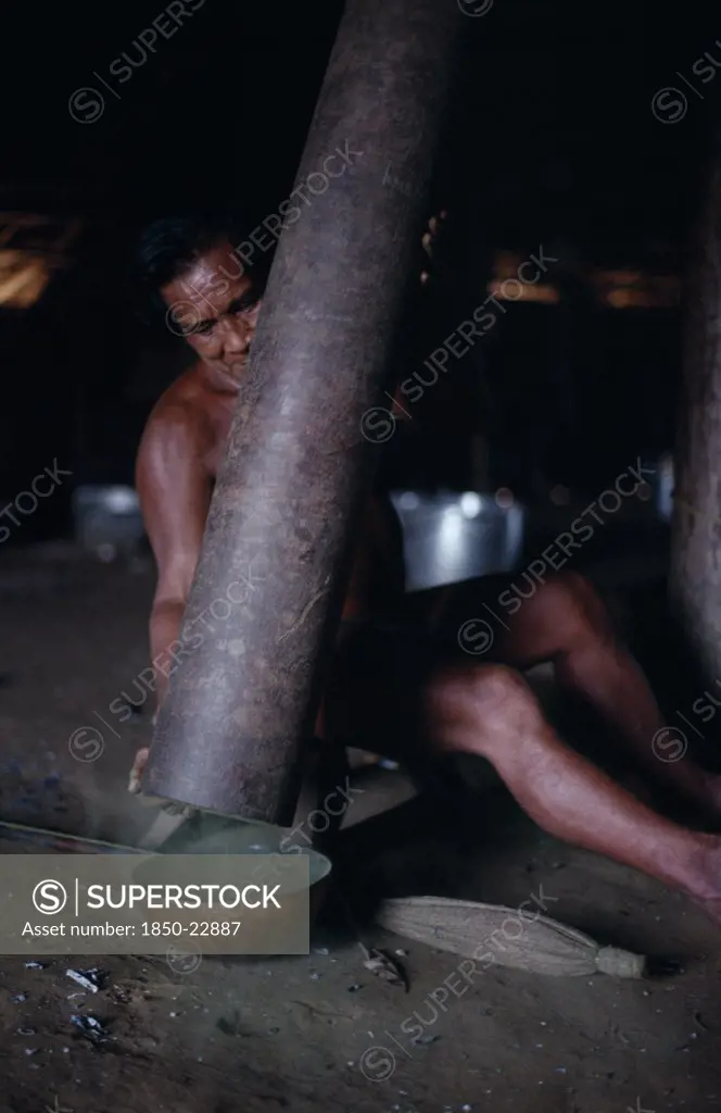 Colombia, North West Amazon, Tukano Indigenous People, Makuna Man Emptying Pounded Powdered Coca From Yarumo Hollow Tube Into Gourd Tukano  Makuna Indian North Western Amazonia American Colombian Columbia  Indegent Latin America Latino Male Men Guy South America Tukano