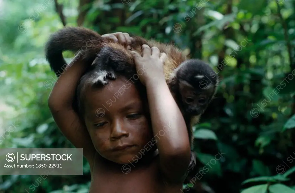 Colombia, North West Amazon, Tukano Indigenous People, Portrait Of Young Makuna Child With Pet Monkey. Tukano  Makuna Indian North Western Amazonia American Children Colombian Columbia Hispanic Indegent Kids Latin America Latino South America Tukano