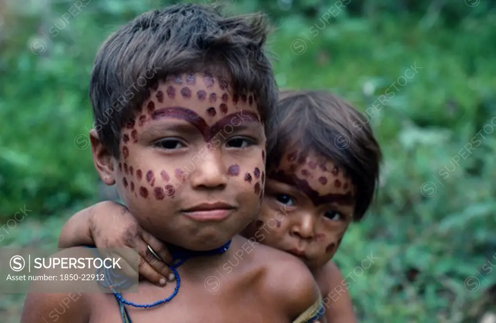 Colombia, North West Amazon, Tukano Indigenous People, Portrait Of Two Young Makuna Children With Dark Red Mixture Of Achiote And We Dye Ceremonial Face Paint. Tukano  Makuna Indian North Western Amazonia American Colombian Columbia Hispanic Indegent Kids Latin America Latino South America Tukano