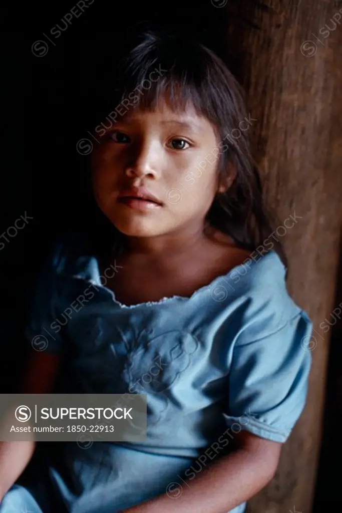 Colombia, North West Amazon, Tukano Indigenous People, Portrait Of Young Makuna Girl At The Entrance To The Maloca Communal Home. Tukano  Makuna Indian North Western Amazonia American Colombian Columbia Hispanic Indegent Kids Latin America Latino South America Tukano