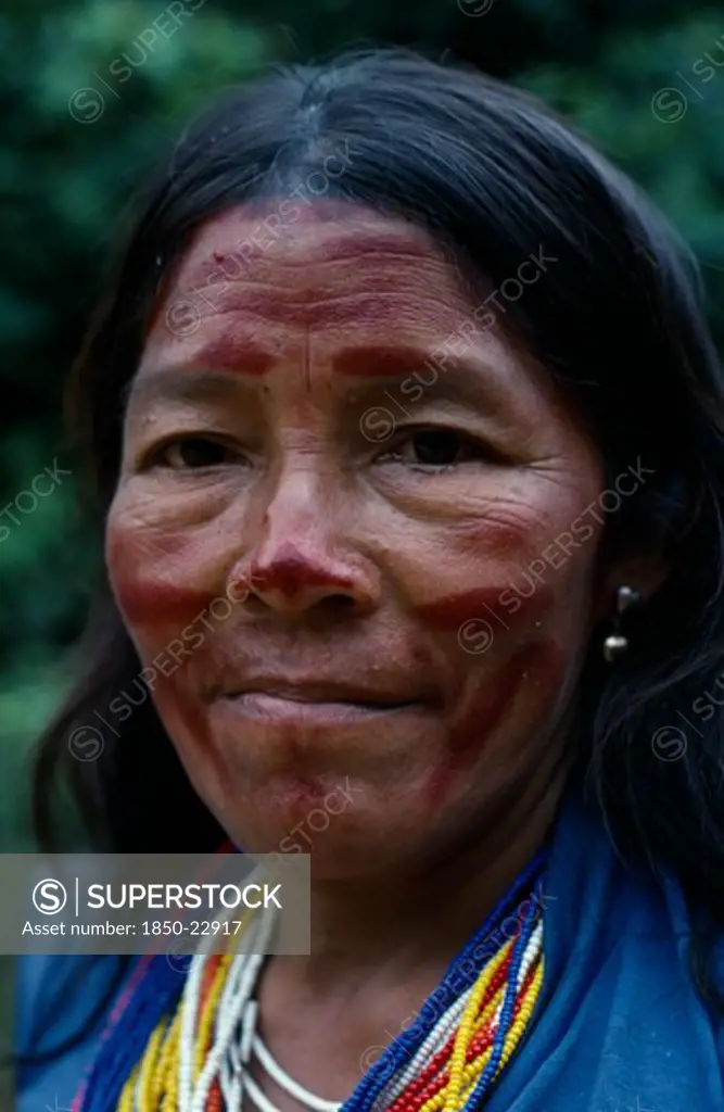 Colombia, North West Amazon, Tukano Indigenous People, Head And Shoulders Portrait Of Makuna Widow With Traces Of Dark Red Achiote Facial Paint And Multiple Strands Of Red  Blue  Yellow And White Beads Indicating Wealth Tukano  Makuna Indian North Western Amazonia American Colombian Columbia Hispanic Indegent Latin America Latino South America Tukano