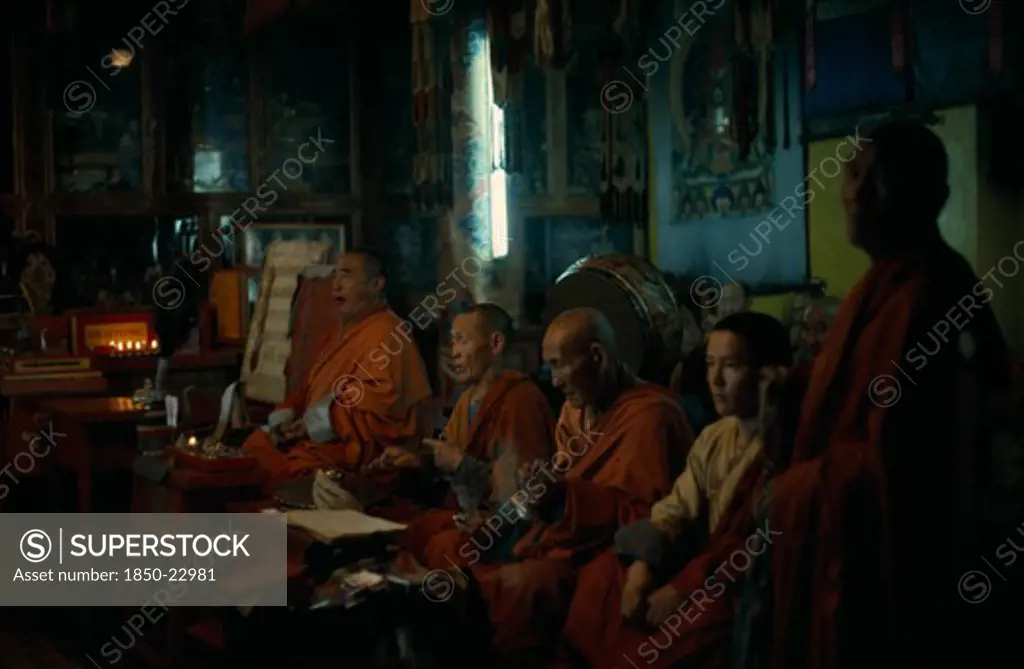 Mongolia, Ulan Bator, 'Ulan Bator Buddhist Temple, The Only One The Russian Dominated Mongol Government Allowed To Exist And Be Used For Worship (In 1970'S) Buddhist Monks Praying In Low Natural Light. '