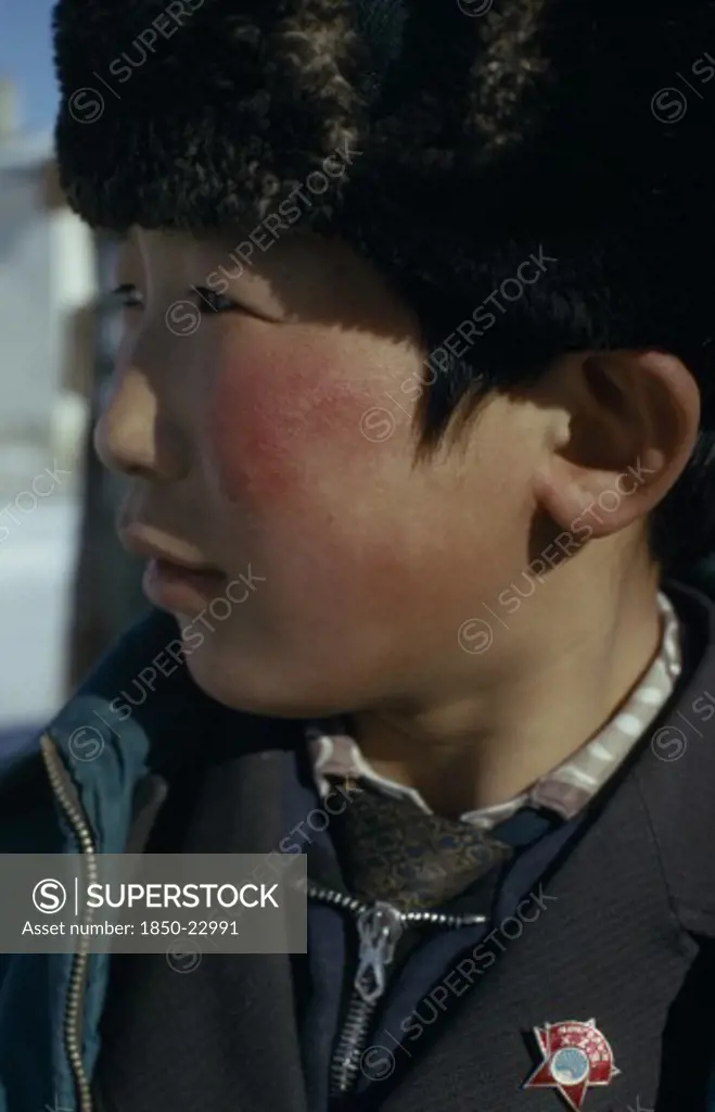 Mongolia, Children, Altai Provincial Capital  Portrait Of Young Boy With Mongolian Communist Party Badge In Profile To Left. East Asia Asian Kids Mongol Uls Mongolian