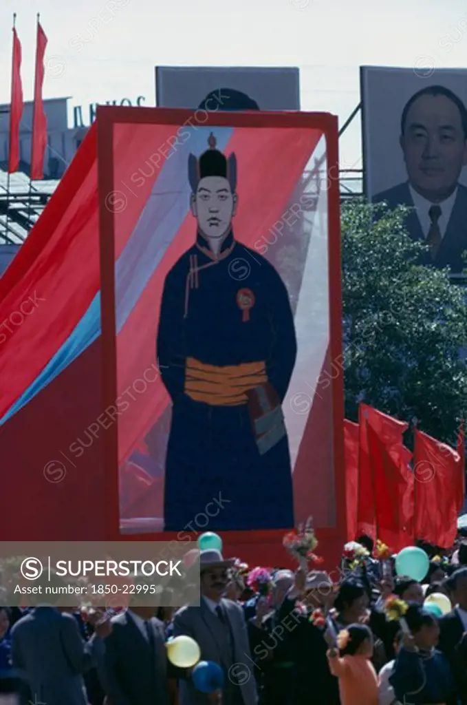 Mongolia, Ulan Bator, Nadam  Mongolian National Day. Parade Of Communist Party Members And Workers Carrying Banners And Posters Of The First Mongolian President Sukhebator In Foreground And Other Important Mongolian Politburo Members Displayed In Background. Ulaan Baatar East Asia Asian Baator Mongol Uls
