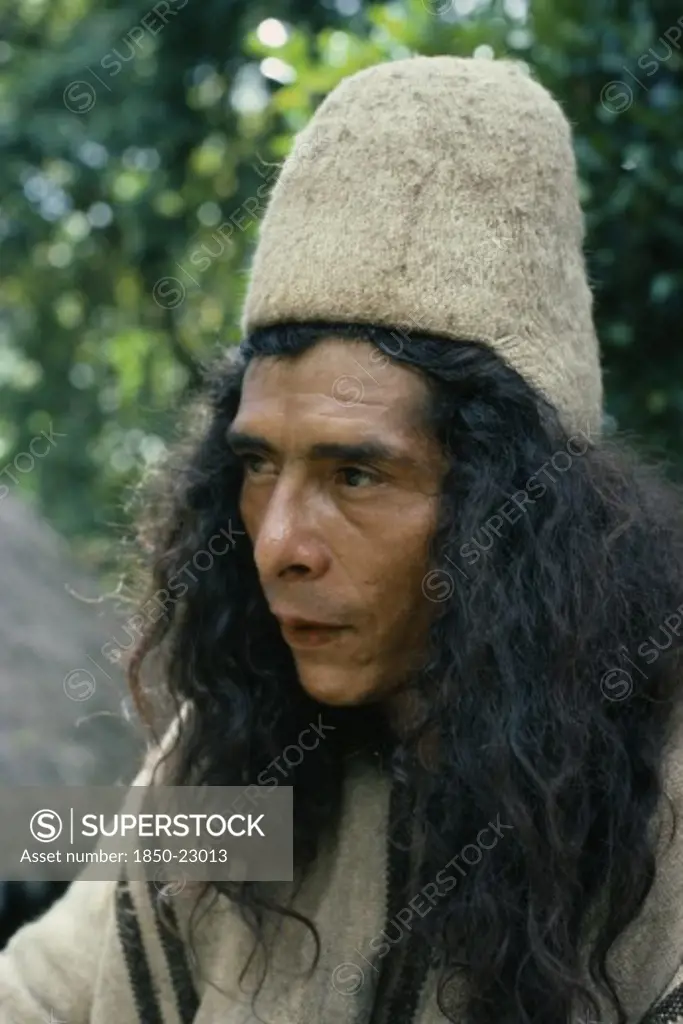 Colombia, Sierra Nevada De Santa Marta, Ika, Portrait Of Ika Man Wearing Traditional Woven Wool And Cotton Cloak And Finely Woven Fique Cactus Helmet. Arhuaco Aruaco Indigenous Tribe American Classic Classical Colombian Columbia Hispanic Historical Indegent Latin America Latino Male Men Guy Older South America