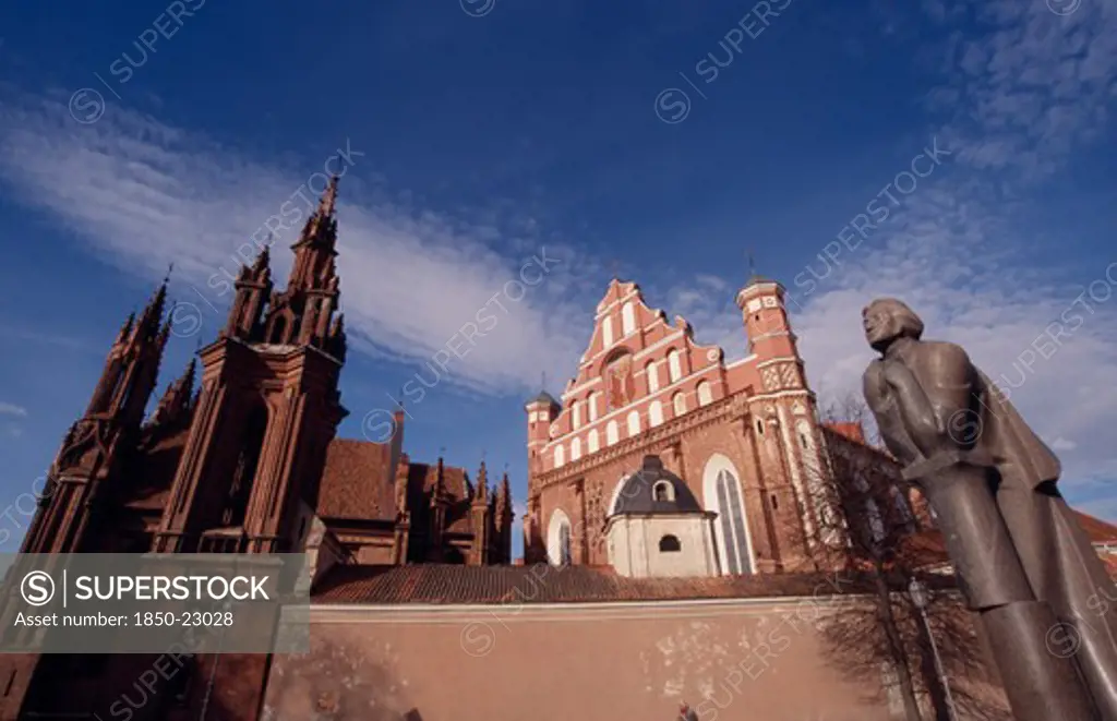 Lithuania, Vilnius, Saint Francis And Bernardine Church Behind The Adam Mickiewicz Statue