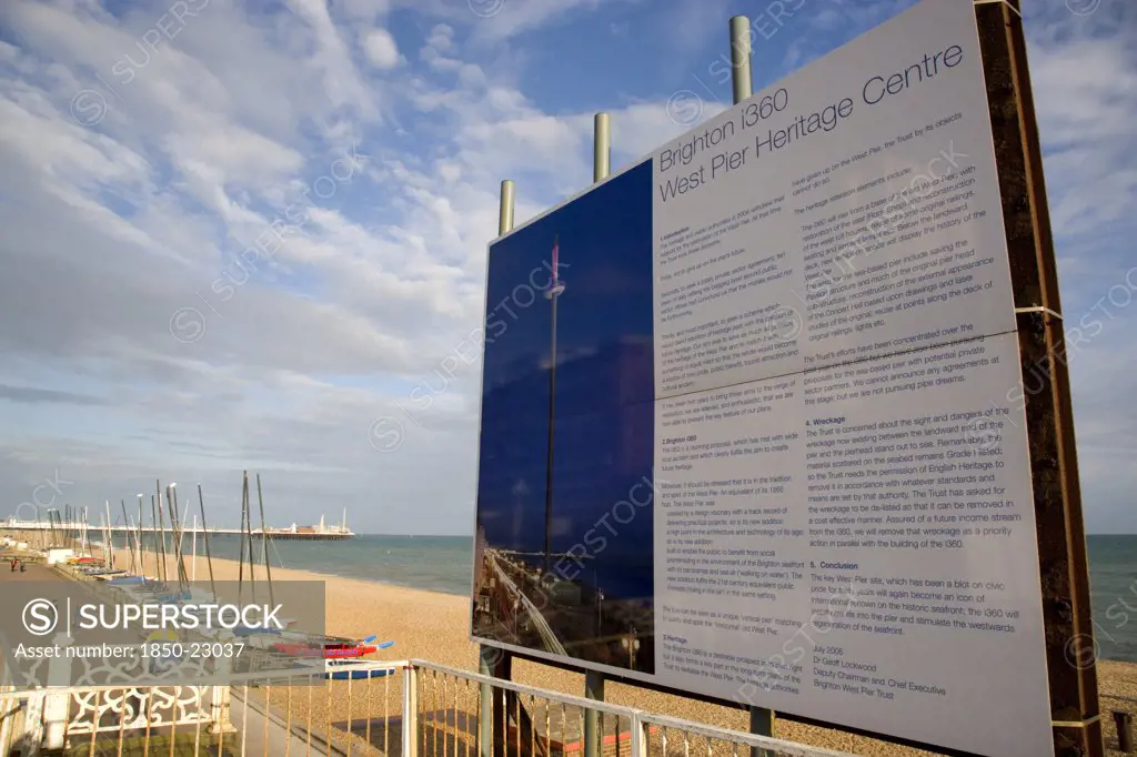 England, East Sussex, Brighton, Ruins Of The West Pier With Boards Showing Plans For The I360 Observation Tower Top Be Built.