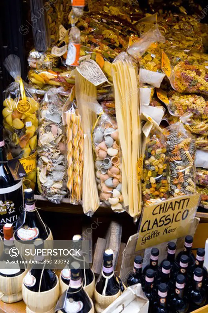 Italy, Tuscany, San Gimignano, Shop Display Of A Variety Of Colourful Pastas And Chianti Wines