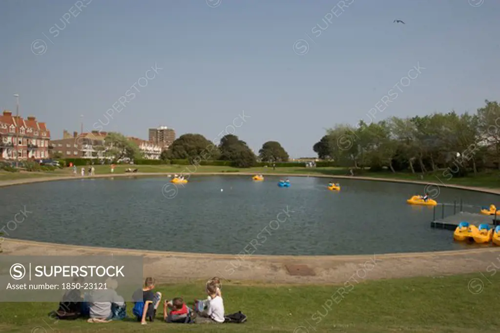 England, West Sussex, Littlehampton, Families Enjoying Pedal Boat Rides At Oyster Pond Boating Lake