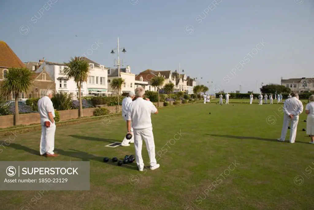 England, West Sussex, Bognor Regis, Men Playing A Game Of Bowls On Green