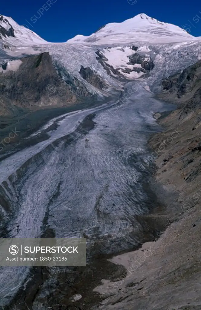 Austria, Hohe Tauern, High Tauern N. Park, Pasterze Glacier In Mountain Range Forming Part Of The Eastern Alps.  Ice Slope And Snow Covering Peaks.