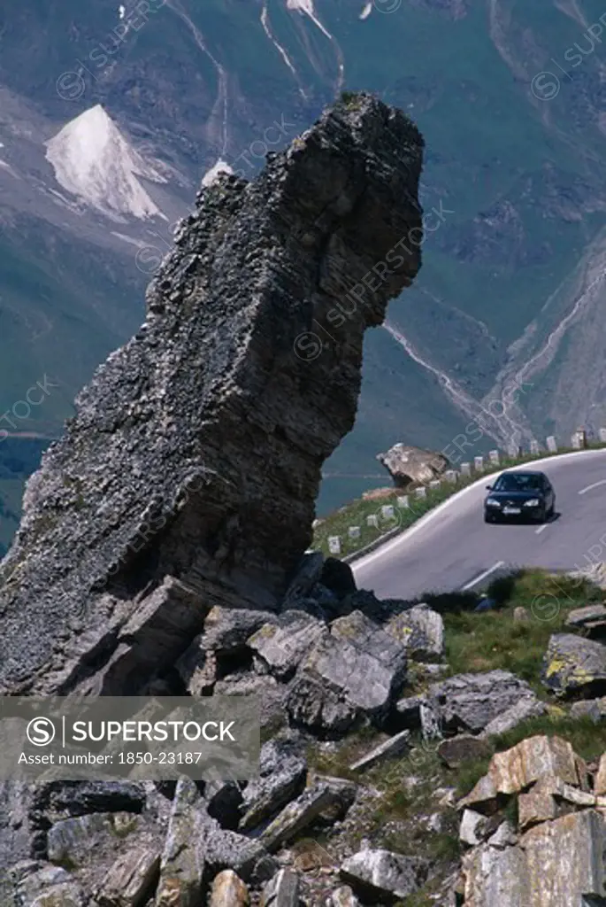 Austria, Hohe Tauern, High Tauern N. Park, Witches Kitchen Rock Formation Above Car On Grossglockner Road In Mountain Range Forming Part Of The Eastern Alps.