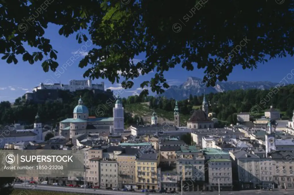 Austria, Salzburg, 'City View From Hettwerr Bastion, Part Of The Old City Walls On Kapuzinerberg Hill.  Part Framed By Tree Branches.'
