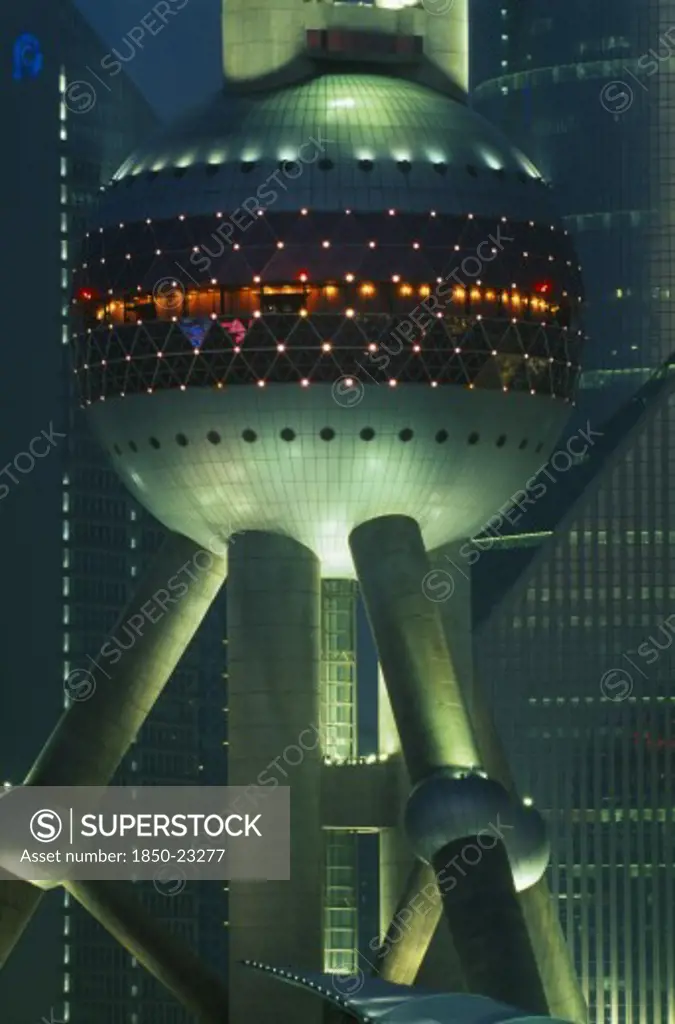 China, Shanghai, Part View Of The Oriental Pearl Tower Exterior Illuminated At Night.