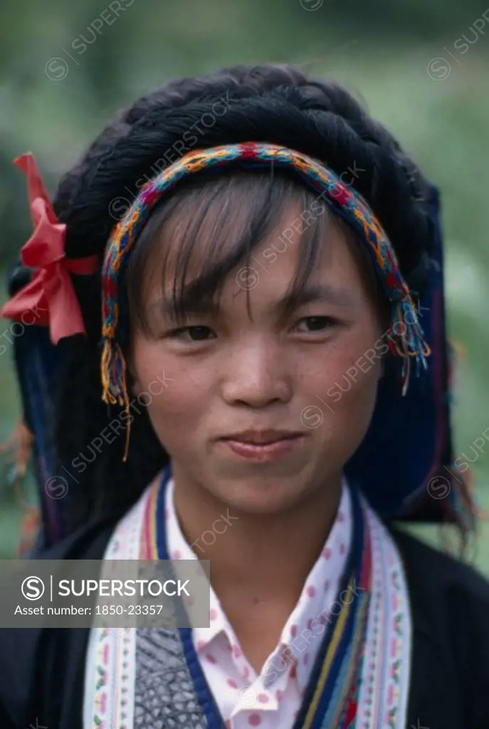 China, Guizhou Province, People, Head And Shoulders Portrait Of Bouyei Girl In Traditional Dress.