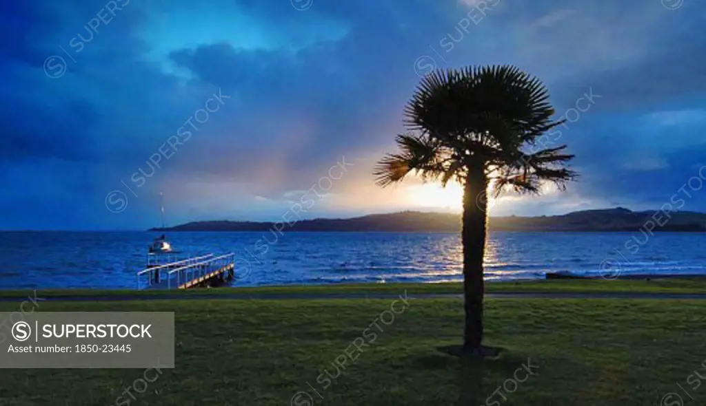 New Zealand, North Island, Taupo, 'Waikato, Sunset Across Lake Taupo From Route 1 Two Mile Bay Towards Acacia Bay On The Opposite Side Of The Lake'
