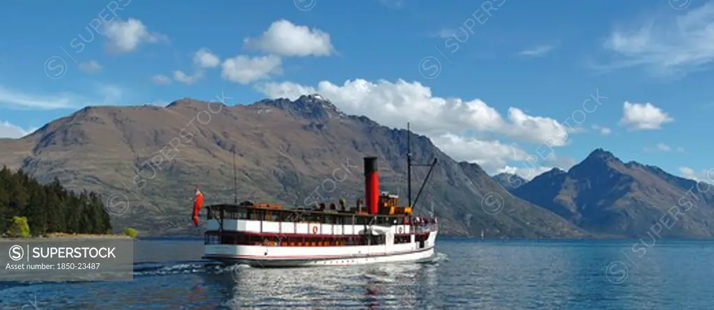 New Zealand, South Island, Otago, 'Queenstown, Vintage Steamship Tss Earnsalw Leaving Steamer Wharf At Queenstown Taking Tourists And Sailing On Lake Wakatipu With Cecil Peak And Walter Peak (Far R) Behind.'