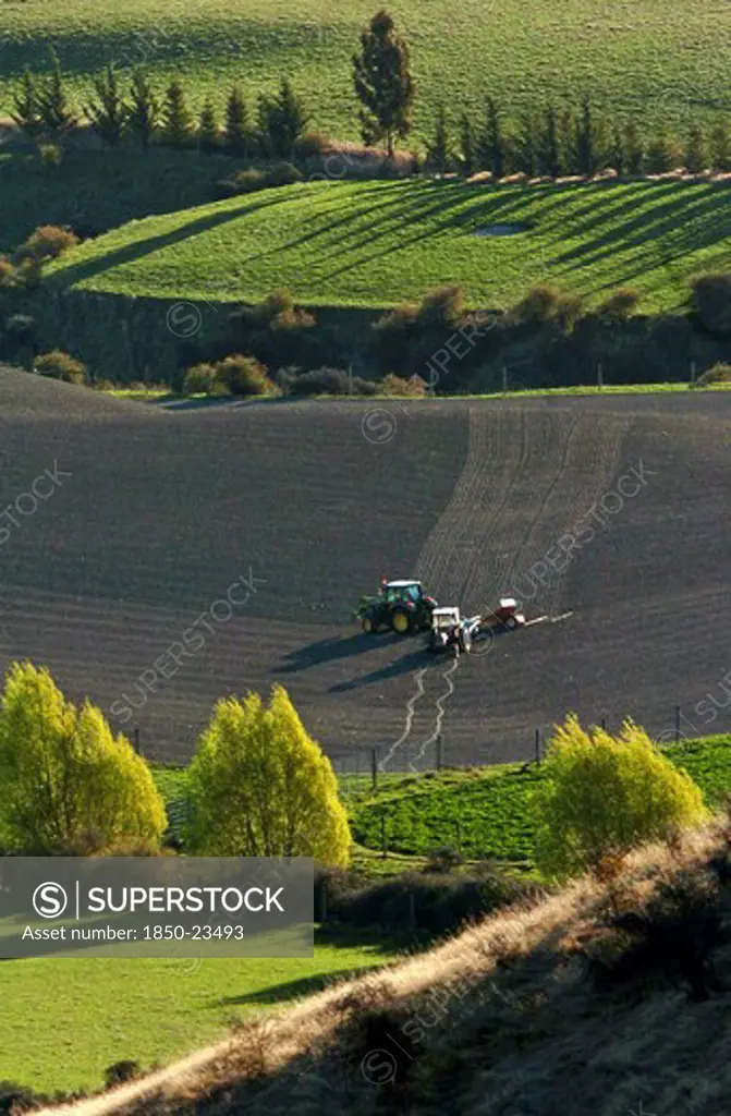 New Zealand, South Island, Otago, 'Arrowtown, A Tractor Ploughs A Field In The Crown Terrace District Near To Arrowtown, '