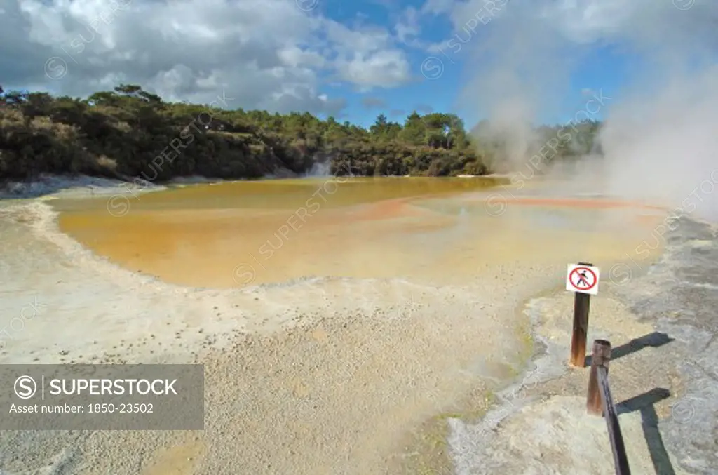 New Zealand, North Island, Rotorua, The Champagne Pool Of Wai O Tapu Thermal Wonderland.The Spring Is 65 Metres In Diameter And 62 Metres Deep.The Pool Was Formed 700 Years Ago By A Hydrothermal Eruption.Various Minerals Are Deposited Around The Surrounding Sinter Ledge Of The Pool Producing Many Different Colours.
