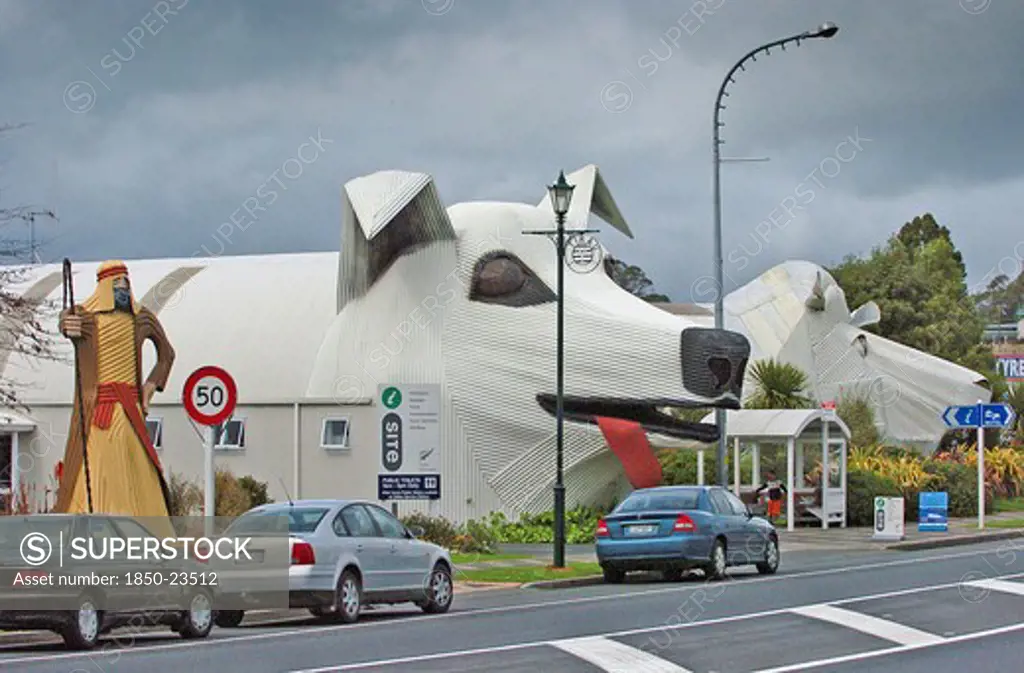 New Zealand, North Island, Waikato, 'Tirau, A Corrugated Iron Sheperd Left At The Entrance To Tirau Co-Operating Church Next To A Sheepdog Centre Which Is The Towns Tourist Informnation Centre And Wool Shop In The Shape Of A Sheep Right Off Main Street In Tirau Town, South Waikato,'