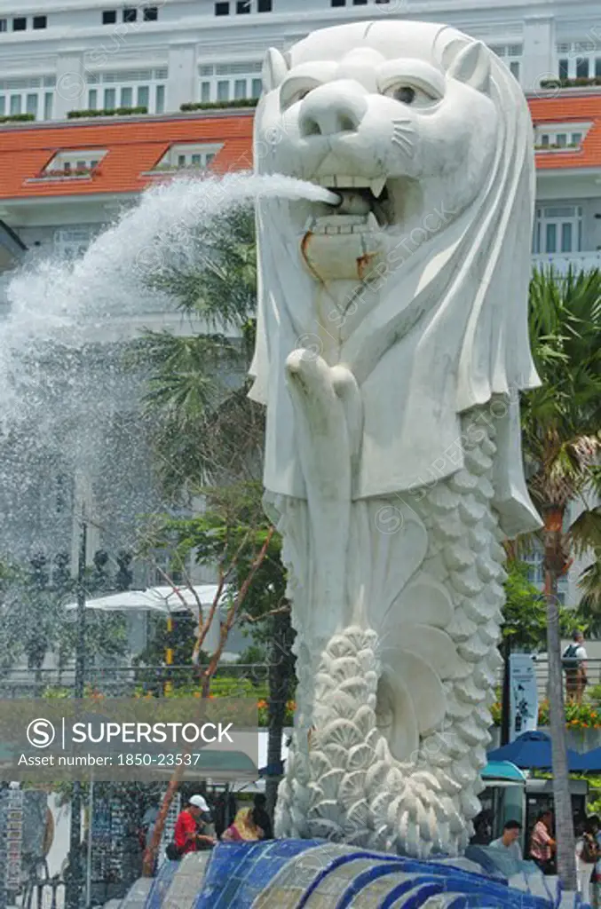 Singapore, Merlion Statue , 'Situated Infront Of The Fullerton Hotel And Finacial District Behind. The Merlion Is One Of The Most Well-Known Tourist Icons Of Singapore. Its Landmark Statue, Once At The Merlion Park, Was Relocated To The Front Of The Fullerton Hotel In April 2002.In 2002, The Statue Was Relocated To Its Current Site That Fronts Marina Bay With The Completion Of The Esplanade Bridge In 1997. The Statue Measures 8.6 Metres High And Weighs 70 Tonnes. The Merlion Was Designed By Fras