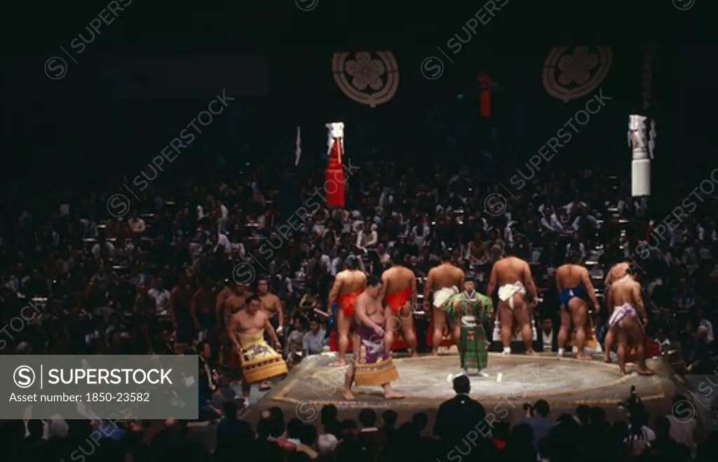 Japan, Samurai, Sumo, Sumo Wrestlers Of The Top Division Perform The Dohyo-Iri Ring Entry Ceremony Before Crowd Of Spectators Before A Grand Championship Fight.